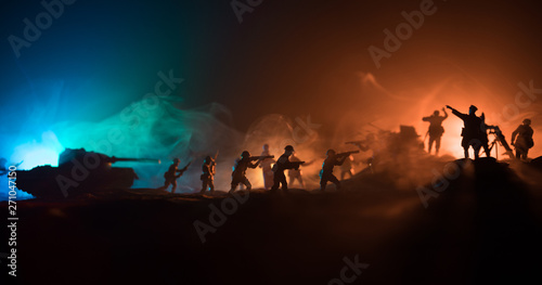 War Concept. Military silhouettes fighting scene on war fog sky background 
