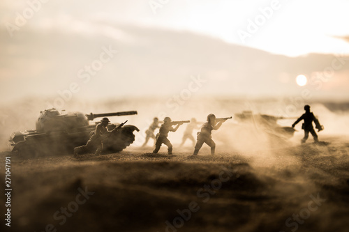 War Concept. Military silhouettes fighting scene on war fog sky background,