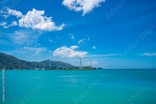 The Seychelles. View of the ocean from the island Mahe. Wind turbines
