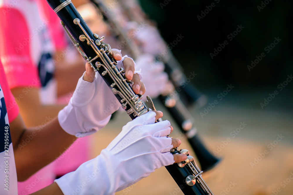 Fototapeta premium Hands of man playing the clarinet in the Marching Band