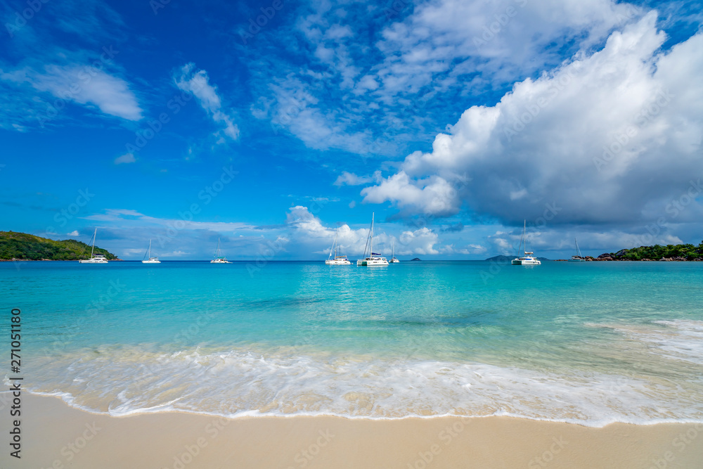 Beautiful sandy beach with turquoise sea on Seychelles. Beautiful sandy beach with turquoise sea on Seychelles.