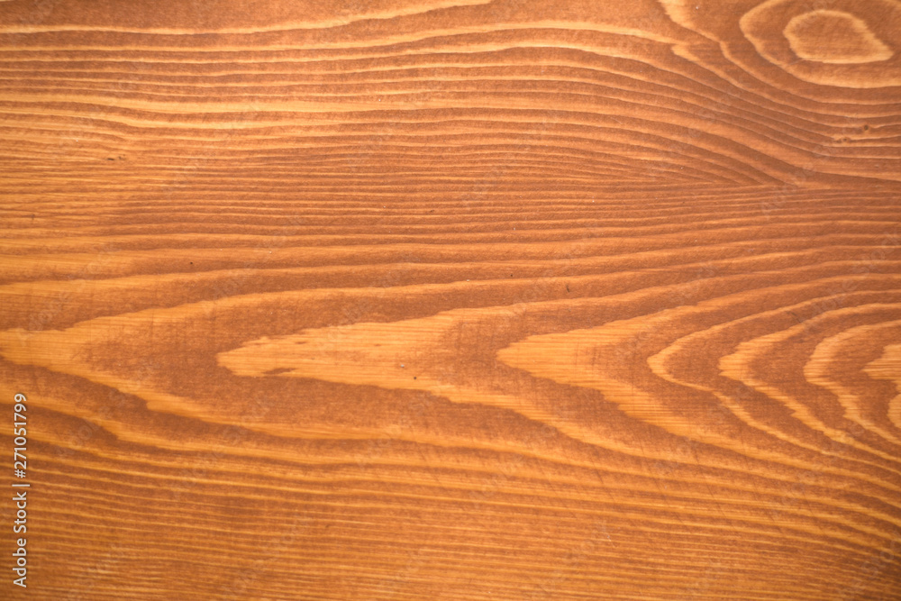 Fototapeta premium texture of pine table covered with cherry wax background close-up