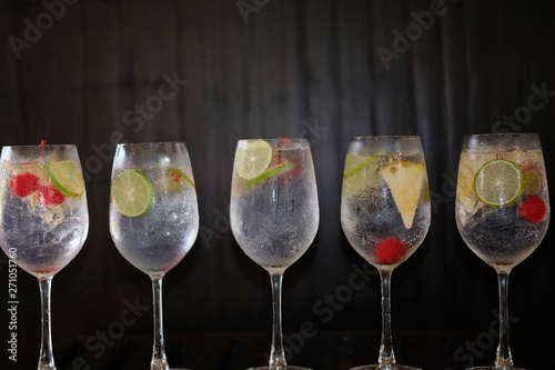 summer drinks of gin tonic alcoholic cocktails on table