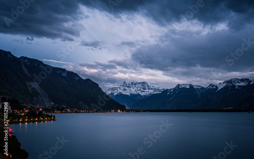 Dusk at Lake Geneva and snow capped mountains in Switzerland