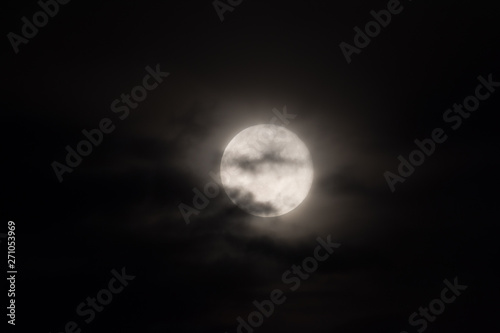 full moon under heavy clouds © pfongabe33