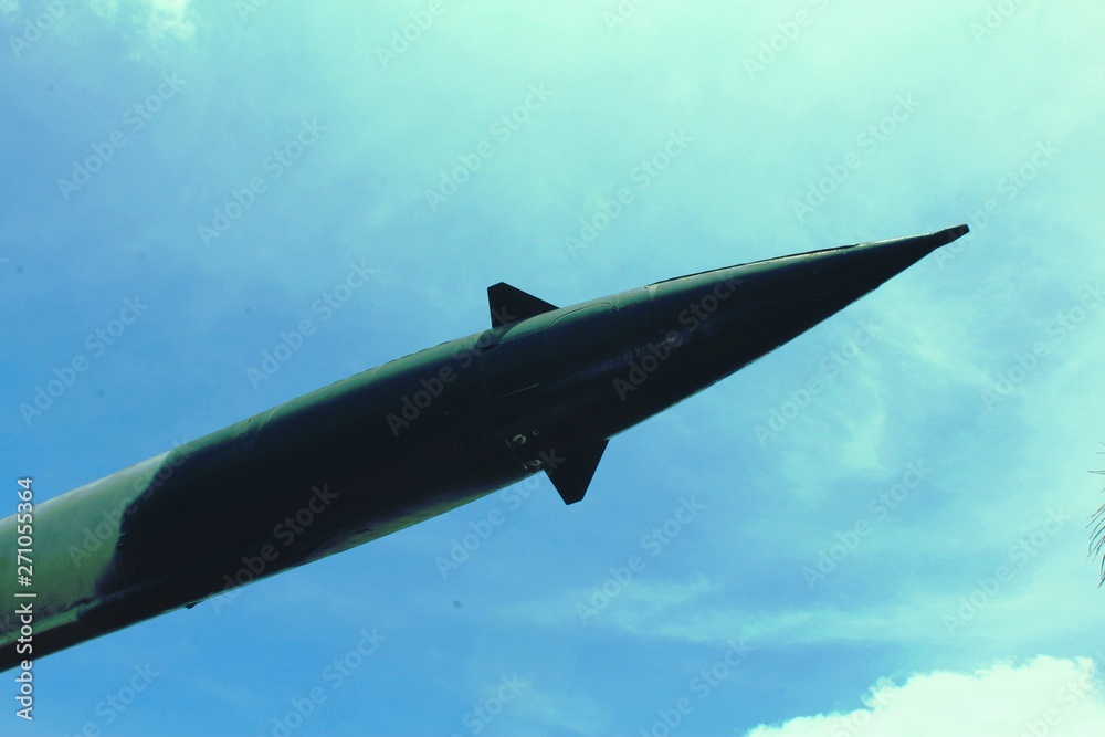 Old military missile against the blue sky. Air Defense. Old military missile against the blue sky. Air Defense.