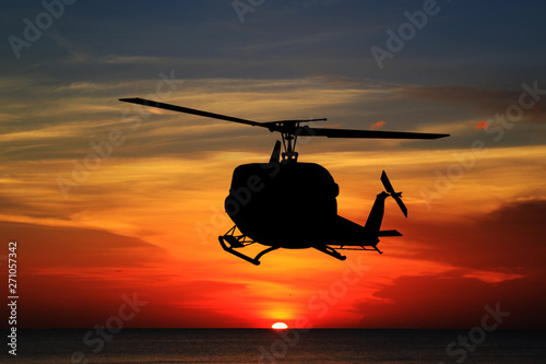 silhouette  the helicopter ...