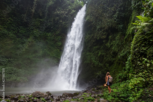 Woman near Nung Nung waterfal on Bali, Indonesia