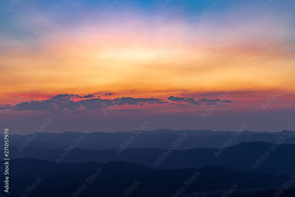 A beautiful colorful of sky and sunrise on the mountain