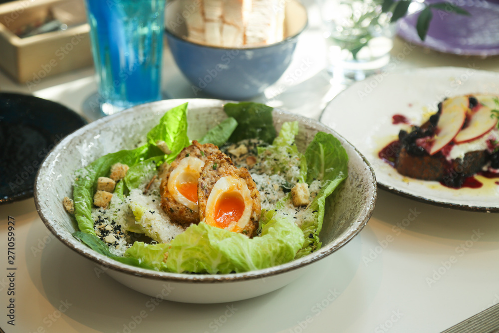 Caesar salad with Scottish egg