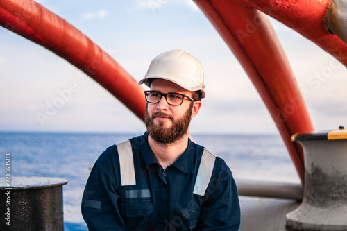 Deck Officer on deck of offshore vessel or ship , wearing PPE personal protective equipment photo