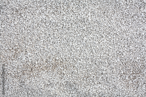 Background texture with small gray rocks.