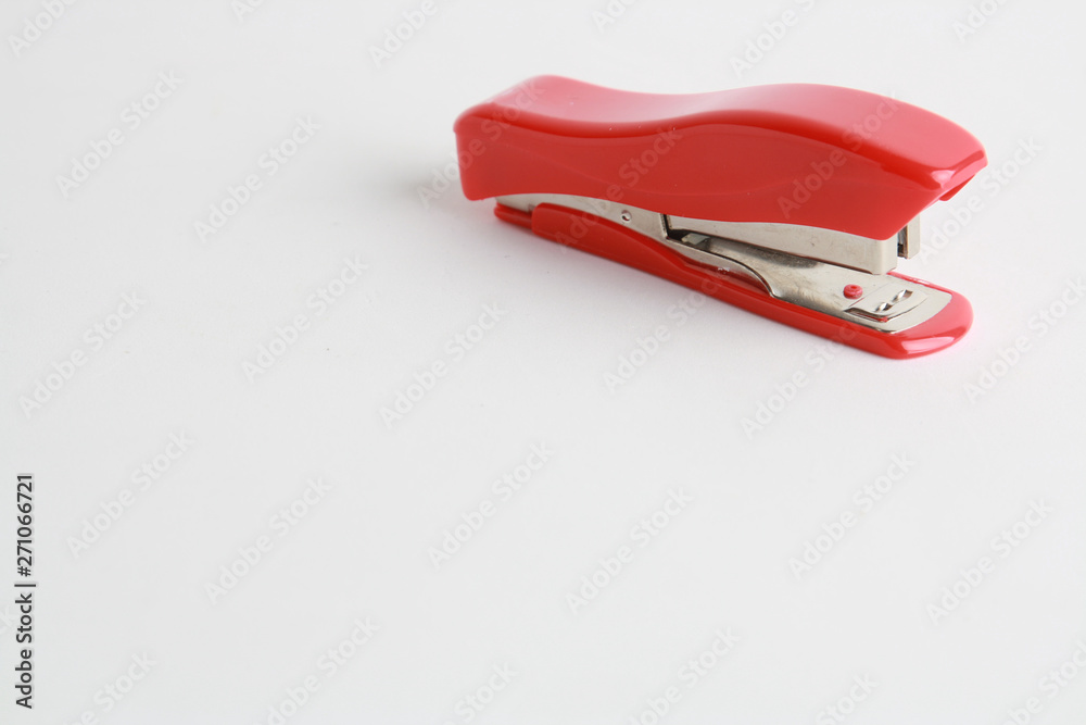 red stapler on white background red stapler on white background