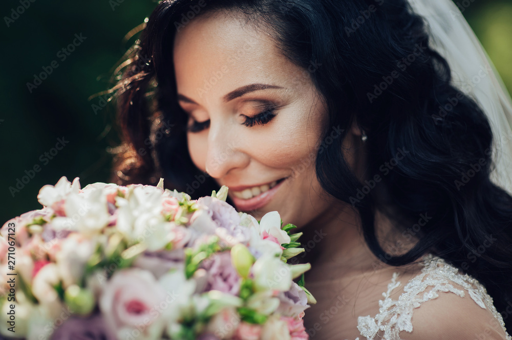 Beautiful bride and groom embracing and kissing on their wedding day. Beautiful bride and groom embracing and kissing on their wedding day.
