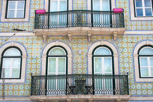 Front of building balconies and colorful mosaic tiles in Lisbon, Portugal. Traditional Portuguese house