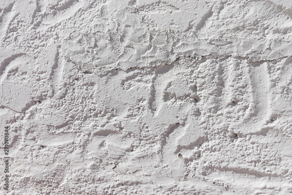 White stucco wall texture background. Plaster wall in Mediterran White stucco wall texture background. Plaster wall in Mediterran