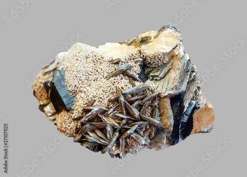 conglomerate of morion, feldspar and mica crystals isolated on gray background photo