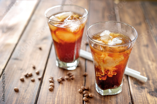Tasty appetizing refreshing cold coffee with ice in glasses.
