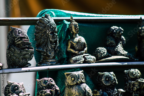 Closeup of traditional decorative objects sold in souvenirs shops in the streets of Reims in France photo