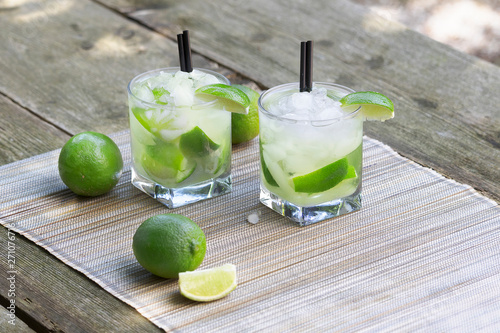 Fresh Caipirinha, Brazilian rum cocktail with lime photo