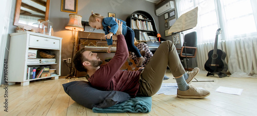 Happy young family playing ...