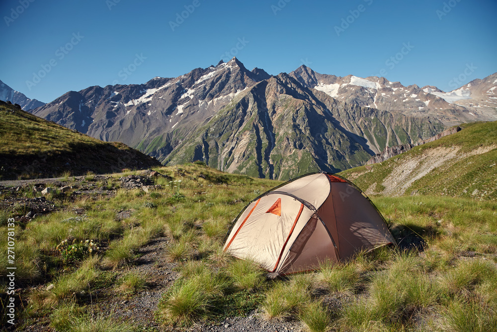 tent in mountains. alpine camp. summer hiking