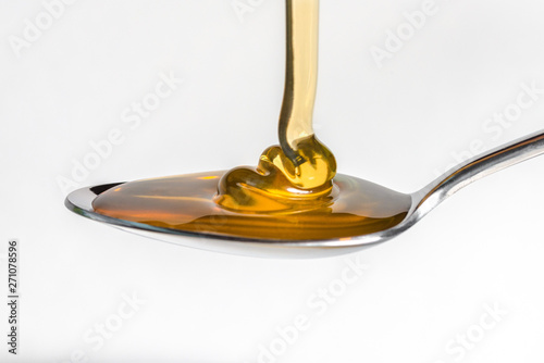 Pouring Honey on a Spoon