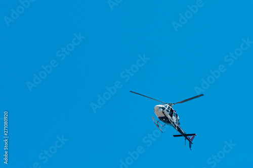 Fototapeta Naklejka Na Ścianę i Meble -  elicopter overhead in blue sky