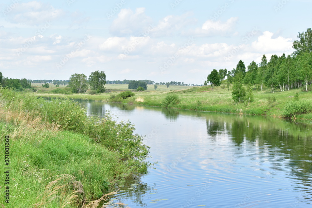 Fototapeta premium River flowing near the mountain.