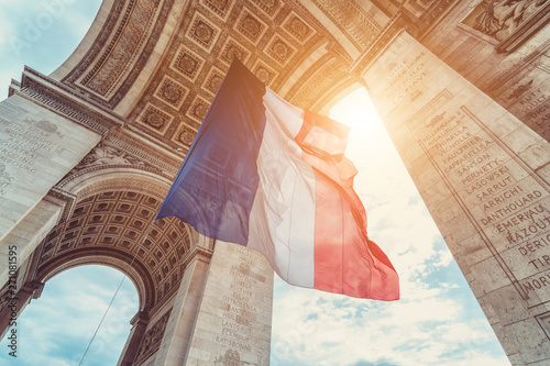 french flag at arc de triomphe during bastille day photo