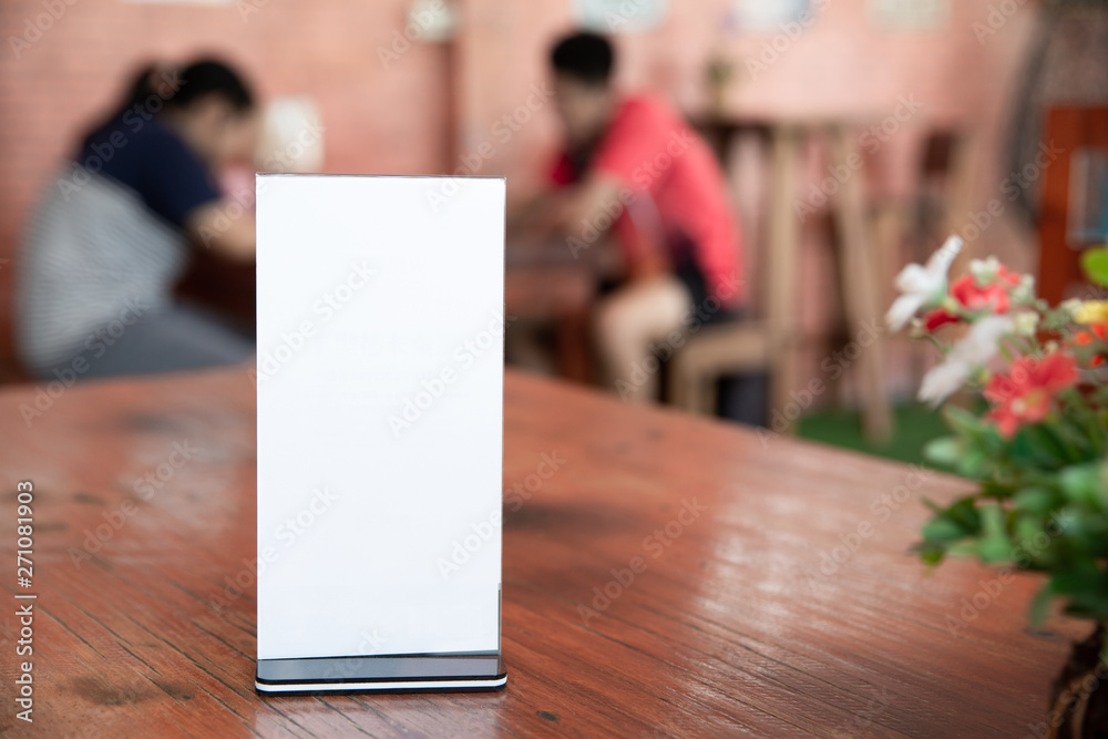 Mock up Menu frame on Table in Bar restaurant-cafeteria,Stand for booklets with white sheets of paper acrylic tent card,can be used for montage or display