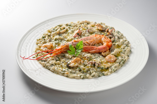 Risotto dish with prawns and seafood and parsley