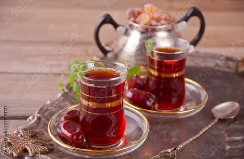 Turkish tea in traditional glass cups on the tray