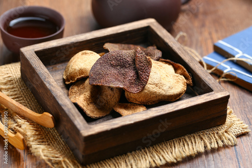 chinese dried tangerine peel in wooden box with tea