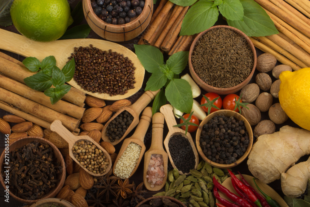 various spices on wooden background various spices on wooden background