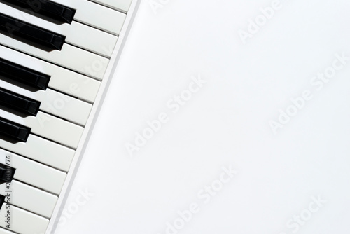 Canvas Print Top view of keyboard instrument on white background with copy space