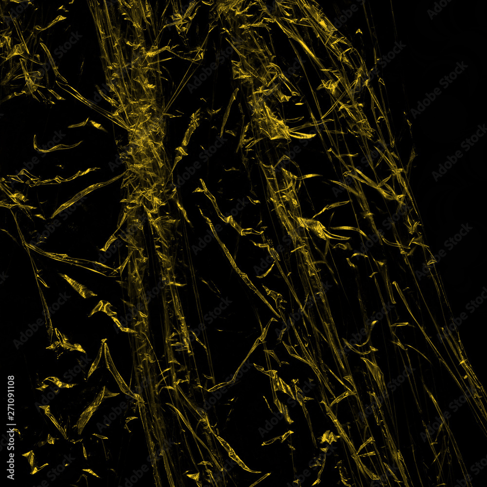 Transparent yellow plastic wrap on the black background. Plastic shopping bag texture. Reusable trash and waste. Transparent yellow plastic wrap on the black background. Plastic shopping bag texture. Reusable trash and waste.