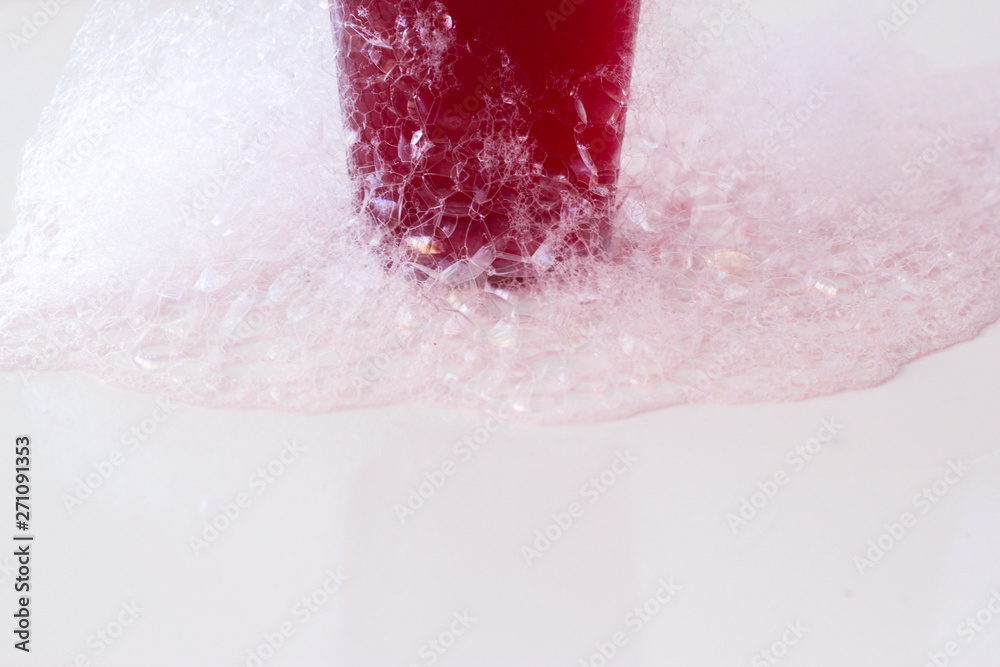 Fototapeta premium soap bubbles on a glass on white background