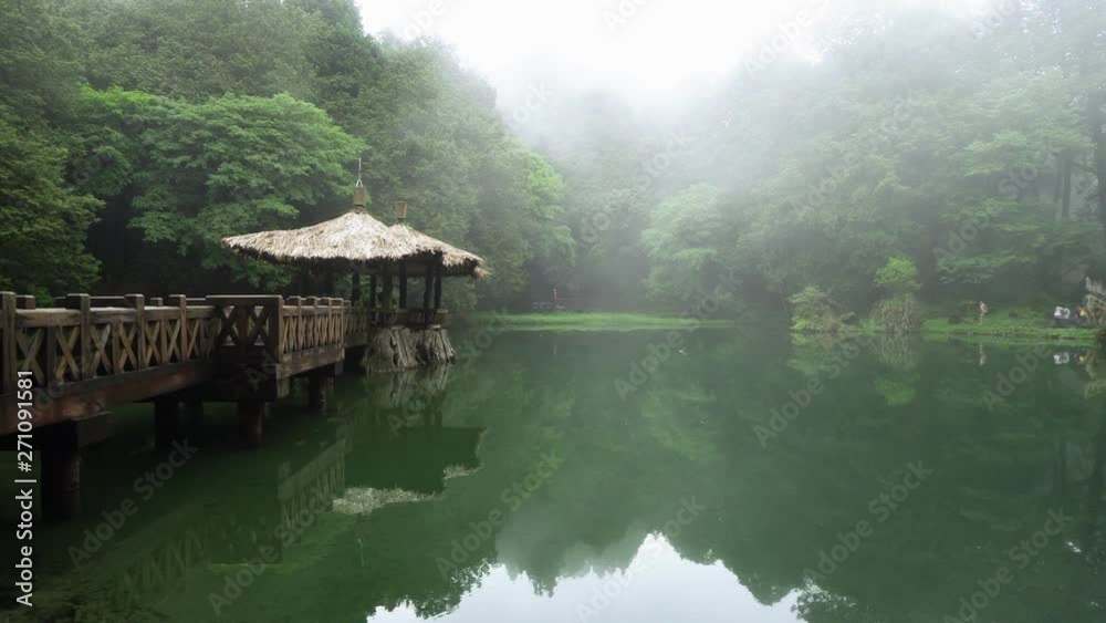 Sister Pond in Alishan National Scenic Area in Taiwan. Panoramic View of Lake with Gazebo in Misty Day Sister Pond in Alishan National Scenic Area in Taiwan. Panoramic View of Lake with Gazebo in Misty Day