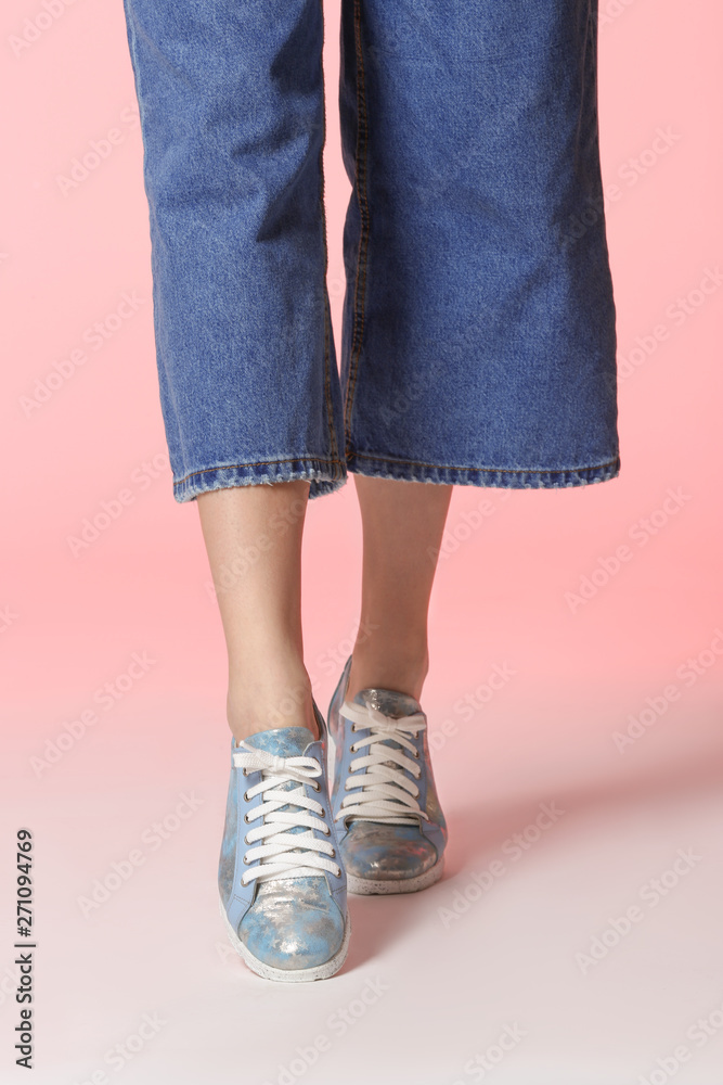 Woman in stylish shoes on color background, closeup Woman in stylish shoes on color background, closeup