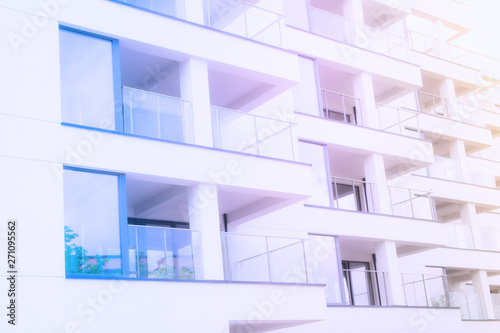 Rows of flats in modern residental building in pastel tone.