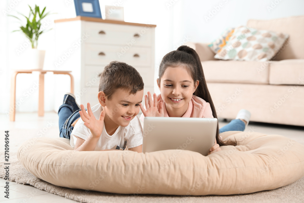 Little children using video chat on tablet at home Little children using video chat on tablet at home