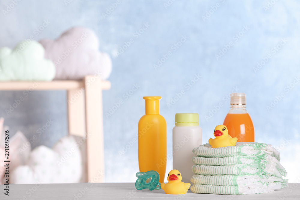 Set with baby accessories on table indoors, space for text Set with baby accessories on table indoors, space for text