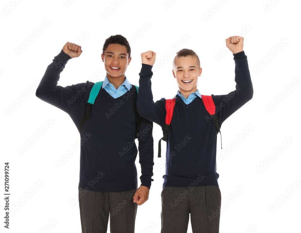 Portrait of teenage boys in school uniform with backpacks on white background Portrait of teenage boys in school uniform with backpacks on white background
