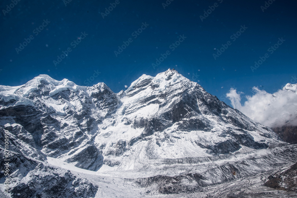 Obraz premium When one thinks of the Himalayas extreme treks and immense labors of Nepal come to mind
