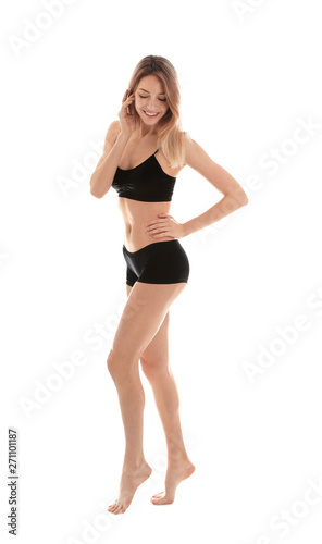 Young slim woman on white background. Perfect body