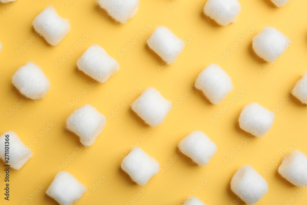 Many fluffy cotton balls on color background, flat lay Many fluffy cotton balls on color background, flat lay