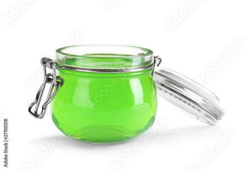 Tasty colorful jelly in glass jar on white background