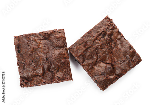 Fotografía Pieces of fresh brownie on white background, top view