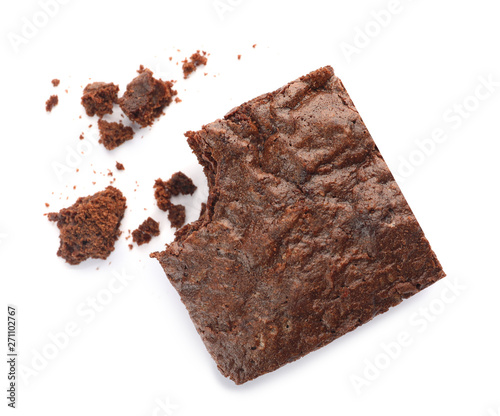Piece of fresh brownie on white background, top view. Delicious chocolate pie